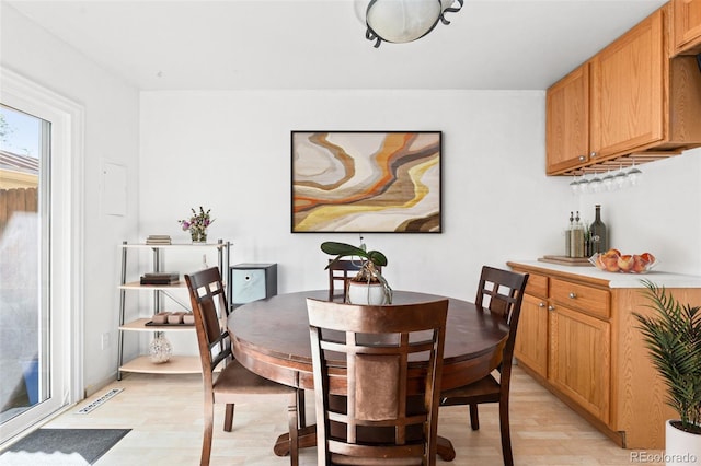 dining area with light wood-type flooring