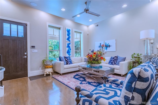 living area with recessed lighting, baseboards, ceiling fan, visible vents, and wood finished floors