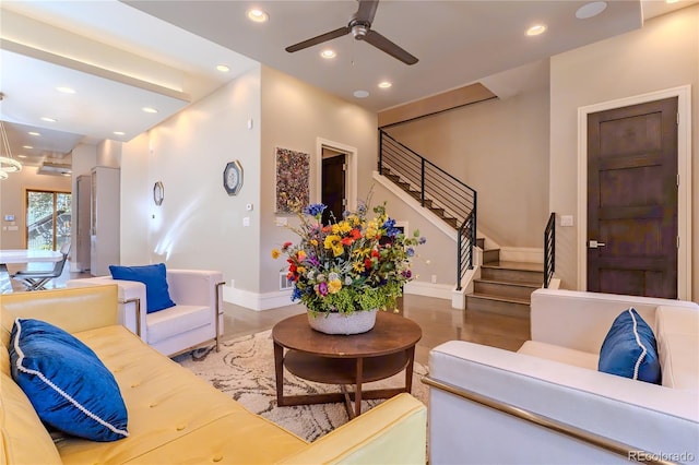 living room with baseboards, recessed lighting, stairway, and ceiling fan