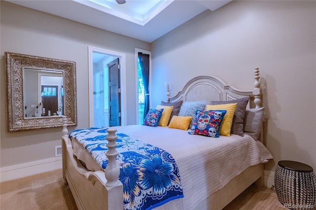 carpeted bedroom featuring baseboards