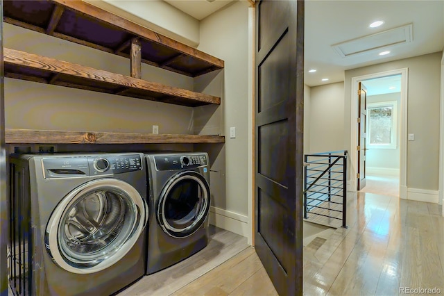 laundry room with attic access, recessed lighting, washer and dryer, baseboards, and light wood-style floors
