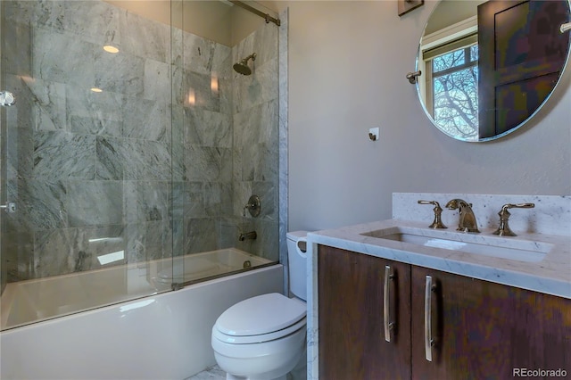 full bathroom with vanity, toilet, and enclosed tub / shower combo