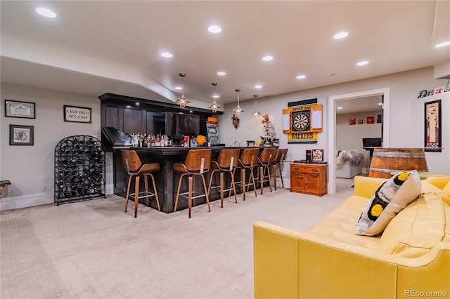 bar featuring wet bar, hanging light fixtures, recessed lighting, and light colored carpet