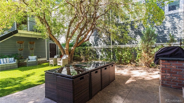 view of patio featuring a grill and outdoor lounge area