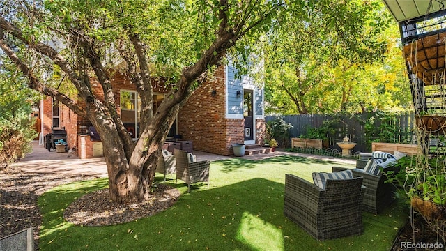 view of yard with a patio and fence