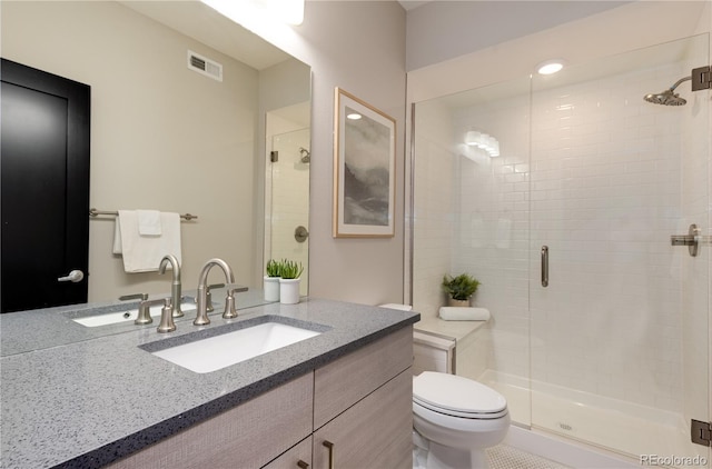 7861 W 51st Ave Unit B, Arvada, CO 80002 - bathroom featuring a stall shower and vanity