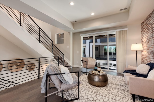 7861 W 51st Ave Unit B, Arvada, CO 80002 - living room featuring wood finished floors, recessed lighting, stairway, and brick wall
