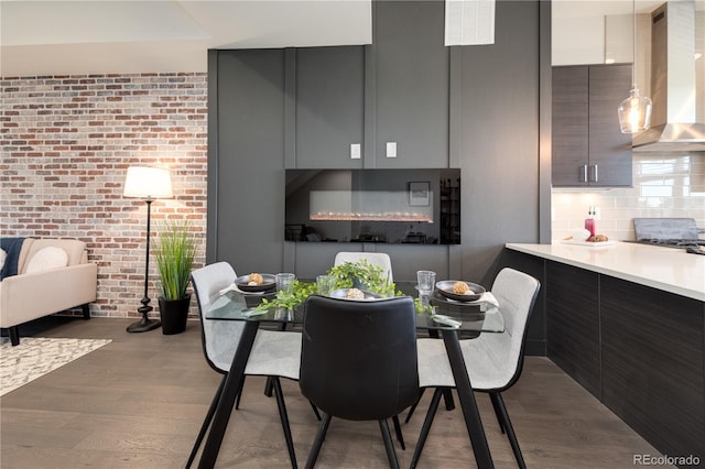 7861 W 51st Ave Unit B, Arvada, CO 80002 - dining room with brick wall and wood finished floors