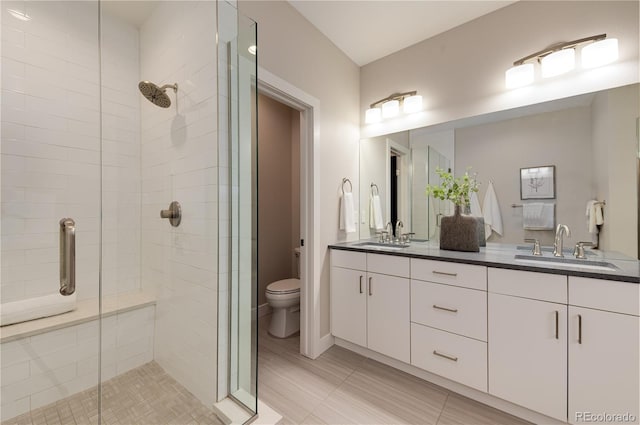 7861 W 51st Ave Unit B, Arvada, CO 80002 - full bath featuring a shower stall, double vanity, and tile patterned flooring