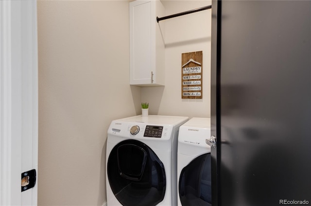 7861 W 51st Ave Unit B, Arvada, CO 80002 - laundry area with washer and dryer and cabinet space