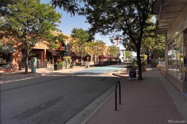 7861 W 51st Ave Unit B, Arvada, CO 80002 - view of asphalt street with sidewalks, street lights, and curbs