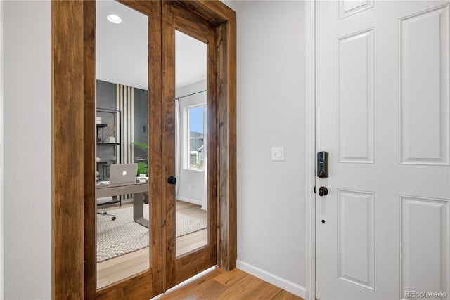 8028 Williams Fork Ave, Littleton, CO 80125 - entrance foyer with baseboards and wood finished floors