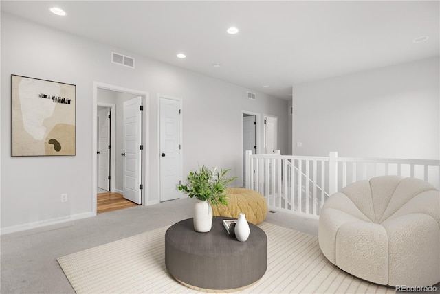 8028 Williams Fork Ave, Littleton, CO 80125 - living area with carpet floors, recessed lighting, and an upstairs landing