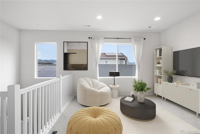 8028 Williams Fork Ave, Littleton, CO 80125 - living area featuring light carpet and recessed lighting