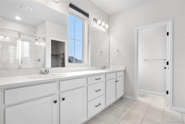 8028 Williams Fork Ave, Littleton, CO 80125 - bathroom featuring double vanity, healthy amount of natural light, and a shower stall