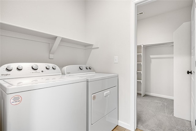 8028 Williams Fork Ave, Littleton, CO 80125 - laundry room with separate washer and dryer and light colored carpet