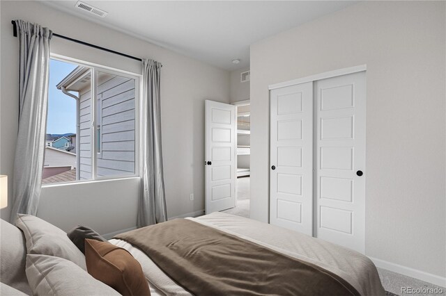 8028 Williams Fork Ave, Littleton, CO 80125 - carpeted bedroom with a closet and baseboards