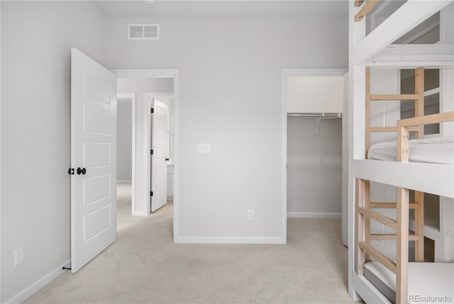 8028 Williams Fork Ave, Littleton, CO 80125 - unfurnished bedroom with light carpet, a walk in closet, and a closet