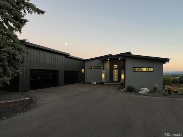 view of front of home featuring driveway and an attached garage