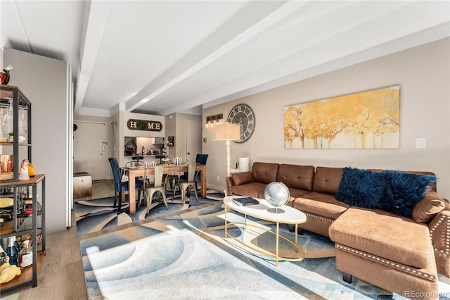1265 Race St Unit 203, Denver, CO 80206 - living area with wood finished floors and beam ceiling