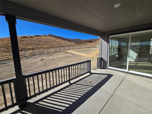 balcony featuring a rural view