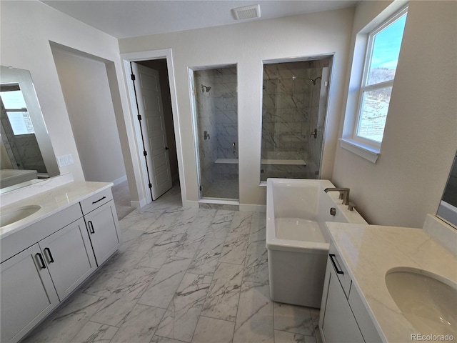 bathroom with vanity and independent shower and bath