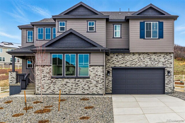 view of front of property featuring an attached garage and driveway