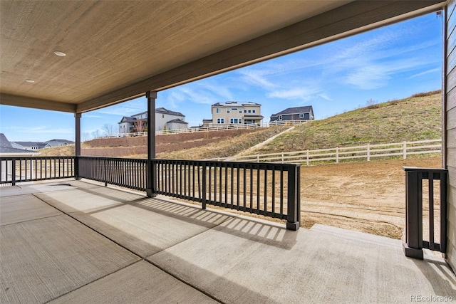 view of patio / terrace featuring fence