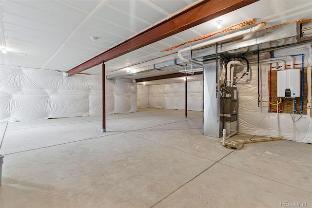 unfinished basement featuring heating unit and water heater