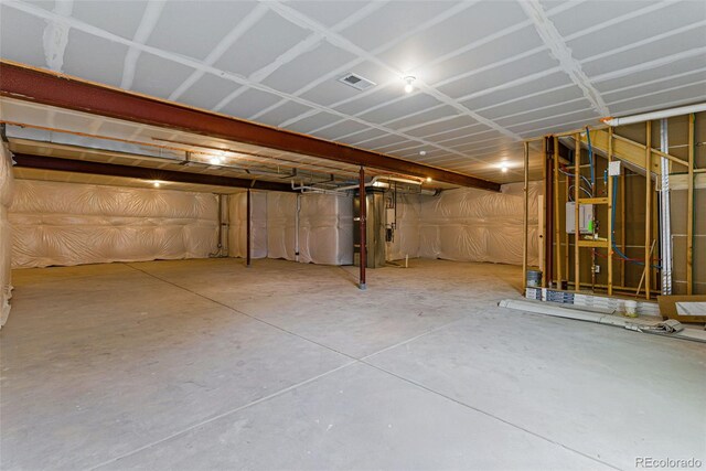 unfinished basement featuring visible vents