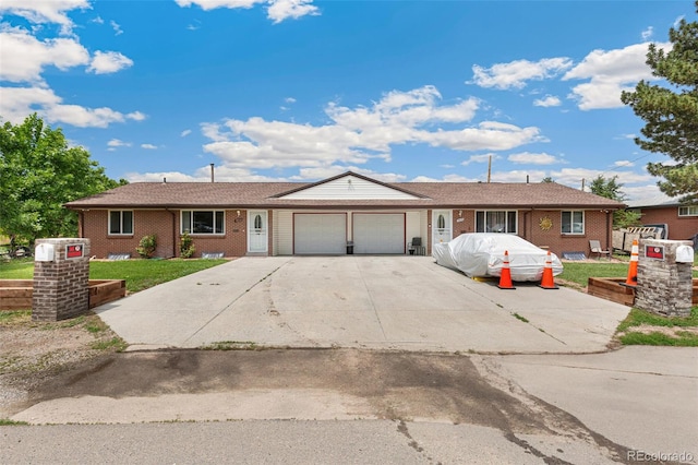 5645 W 5th Ave Unit 5645 & 5655, Lakewood, CO 80226 - single story home with a garage, brick siding, driveway, and a front yard