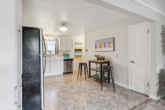 5645 W 5th Ave Unit 5645 & 5655, Lakewood, CO 80226 - kitchen with stainless steel appliances, white cabinets, and light countertops