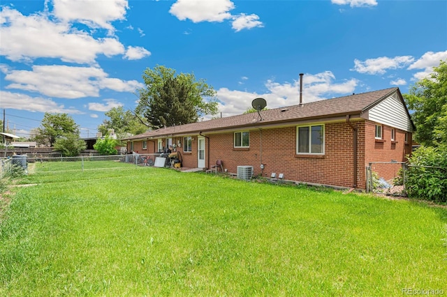 5645 W 5th Ave Unit 5645 & 5655, Lakewood, CO 80226 - rear view of property featuring brick siding and a fenced backyard
