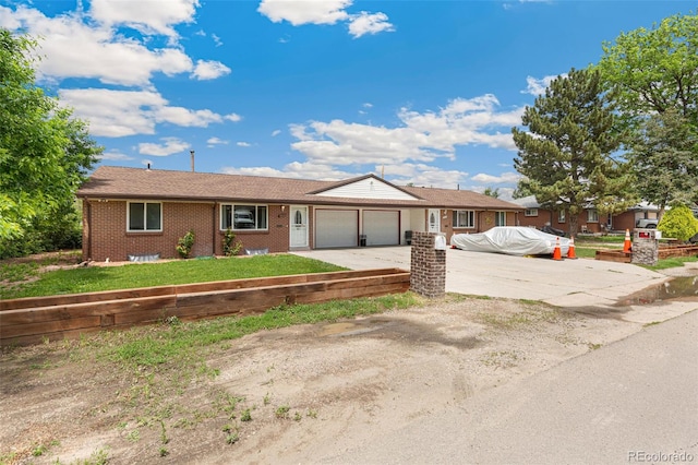 5645 W 5th Ave Unit 5645 & 5655, Lakewood, CO 80226 - ranch-style home with an attached garage, concrete driveway, a front yard, and brick siding