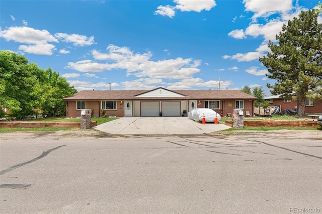 5645 W 5th Ave Unit 5645 & 5655, Lakewood, CO 80226 - ranch-style house featuring a garage, concrete driveway, and brick siding