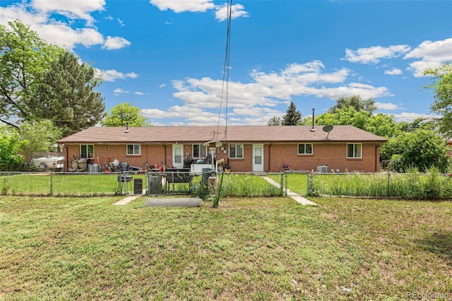 5645 W 5th Ave Unit 5645 & 5655, Lakewood, CO 80226 - back of house with a gate, a fenced backyard, and brick siding