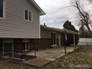 206 Cielo Vista St, Colorado Springs, CO 80911 - view of side of home featuring a patio