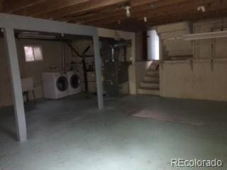 206 Cielo Vista St, Colorado Springs, CO 80911 - unfinished basement with washing machine and clothes dryer and stairs