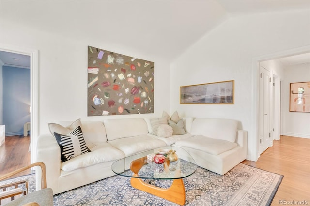 1226 Dexter St, Denver, CO 80220 - living area with wood finished floors and vaulted ceiling