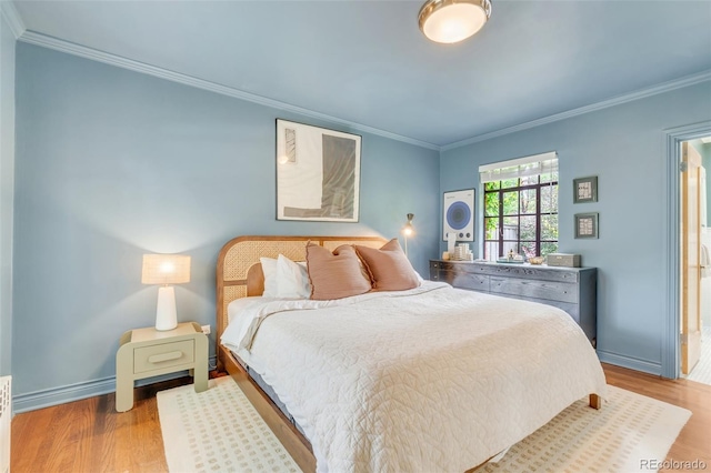 1226 Dexter St, Denver, CO 80220 - bedroom with crown molding, wood finished floors, and baseboards