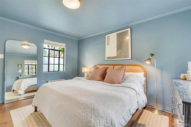 1226 Dexter St, Denver, CO 80220 - bedroom with crown molding, wood finished floors, and baseboards