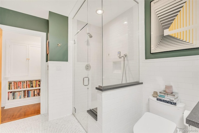 1226 Dexter St, Denver, CO 80220 - bathroom with a shower stall, tile walls, and toilet