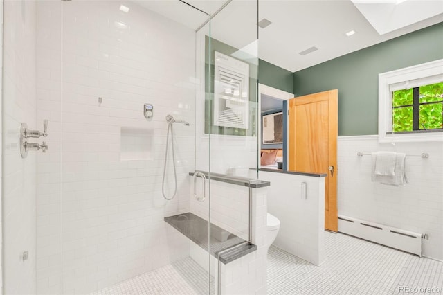 1226 Dexter St, Denver, CO 80220 - bathroom with a baseboard radiator, tile walls, a stall shower, toilet, and tile patterned floors
