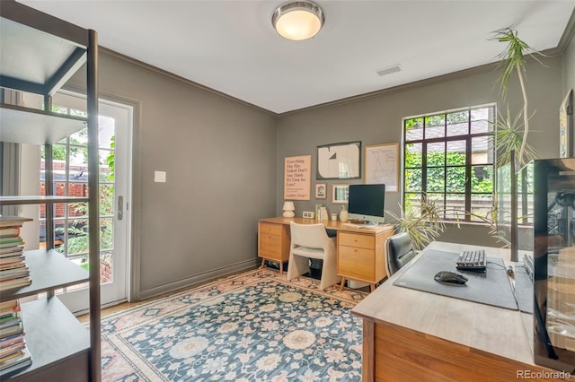 1226 Dexter St, Denver, CO 80220 - home office featuring crown molding and baseboards