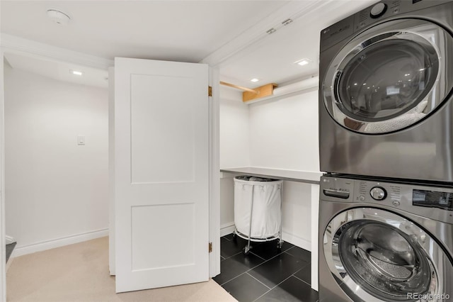 1226 Dexter St, Denver, CO 80220 - laundry area with stacked washer and clothes dryer, baseboards, recessed lighting, and tile patterned flooring