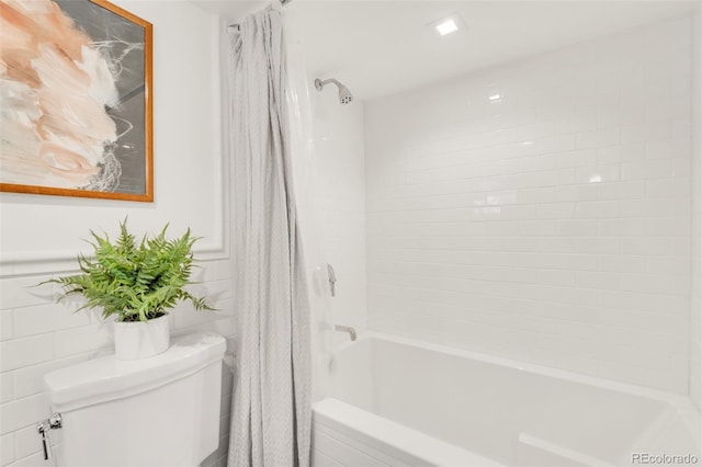 1226 Dexter St, Denver, CO 80220 - bathroom with shower / bath combo, toilet, and tile walls