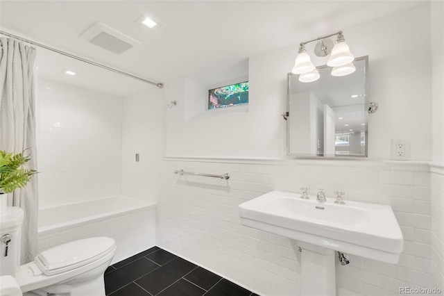 1226 Dexter St, Denver, CO 80220 - bathroom featuring tile walls, tile patterned flooring, toilet, and shower / bath combination with curtain