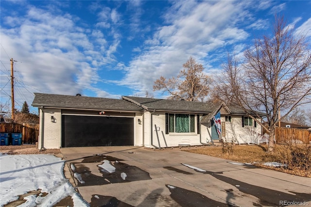 ranch-style home with a garage