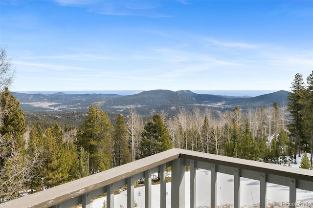 property view of mountains featuring a wooded view