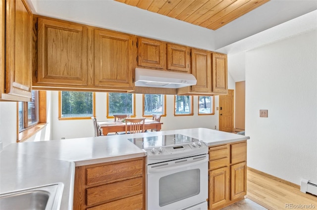 kitchen with baseboard heating, light countertops, under cabinet range hood, light wood-style floors, and white electric range